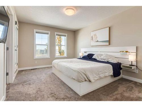 260 Midyard Lane Sw, Airdrie, AB - Indoor Photo Showing Bedroom