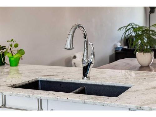 260 Midyard Lane Sw, Airdrie, AB - Indoor Photo Showing Kitchen With Double Sink