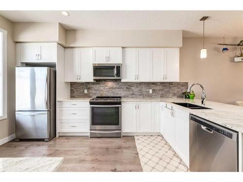 260 Midyard Lane Sw, Airdrie, AB - Indoor Photo Showing Kitchen With Stainless Steel Kitchen With Double Sink With Upgraded Kitchen