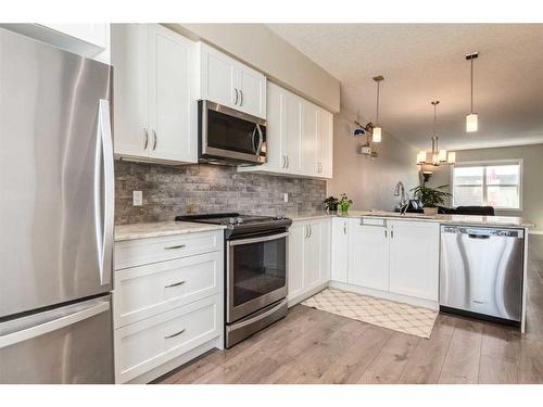 260 Midyard Lane Sw, Airdrie, AB - Indoor Photo Showing Kitchen With Stainless Steel Kitchen With Upgraded Kitchen