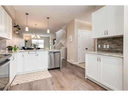 260 Midyard Lane Sw, Airdrie, AB - Indoor Photo Showing Kitchen With Stainless Steel Kitchen With Upgraded Kitchen