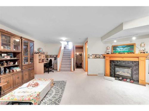 126 Saddlemead Road Ne, Calgary, AB - Indoor Photo Showing Living Room With Fireplace