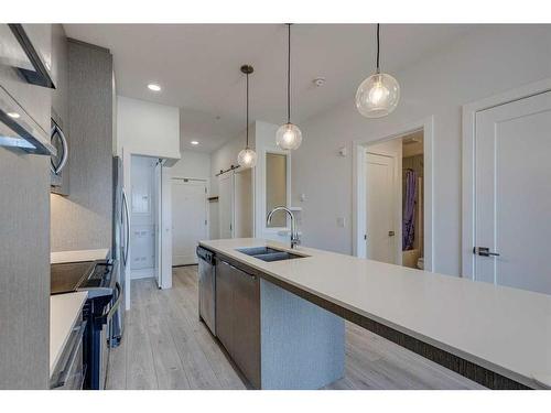 1129-76 Cornerstone Passage Ne, Calgary, AB - Indoor Photo Showing Kitchen With Double Sink With Upgraded Kitchen