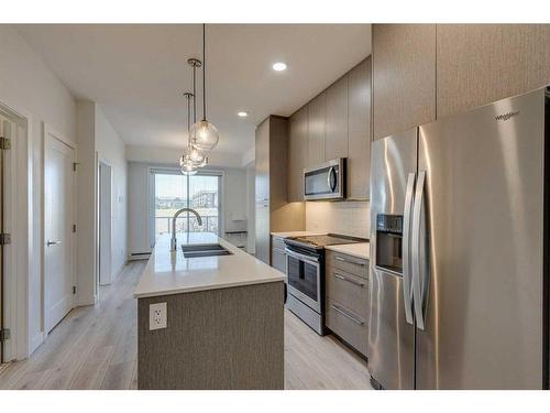 1129-76 Cornerstone Passage Ne, Calgary, AB - Indoor Photo Showing Kitchen With Double Sink With Upgraded Kitchen