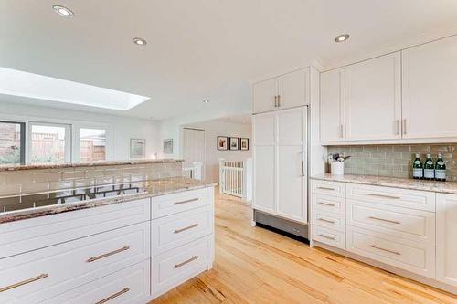 72 Canova Road Sw, Calgary, AB - Indoor Photo Showing Kitchen With Double Sink