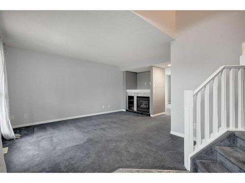 5 Prestwick Mount Se, Calgary, AB - Indoor With Fireplace