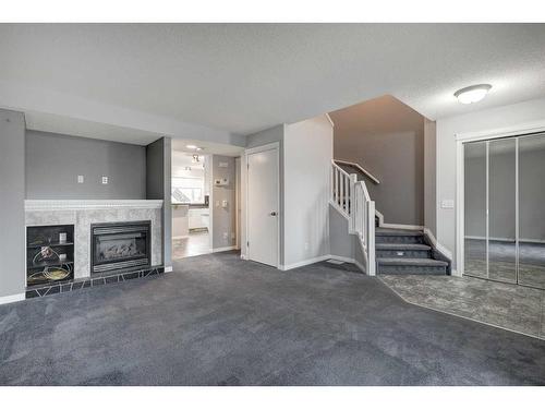 5 Prestwick Mount Se, Calgary, AB - Indoor With Fireplace