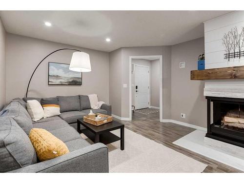 112 Thorson Crescent, Okotoks, AB - Indoor Photo Showing Living Room With Fireplace