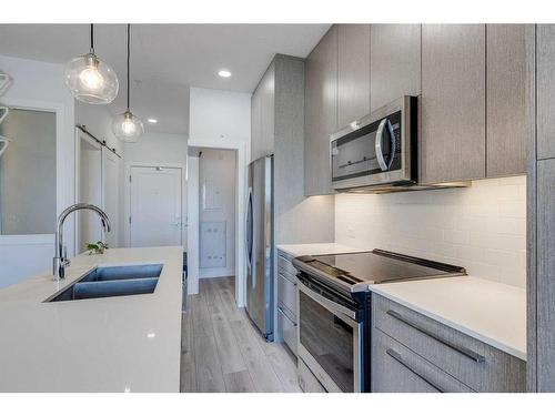 1131-76 Cornerstone Passage Ne, Calgary, AB - Indoor Photo Showing Kitchen With Double Sink With Upgraded Kitchen