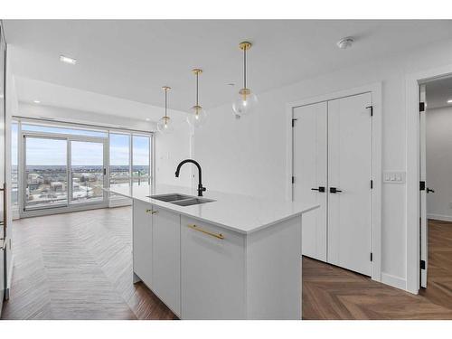 707-8445 Broadcast Avenue Sw, Calgary, AB - Indoor Photo Showing Kitchen With Double Sink