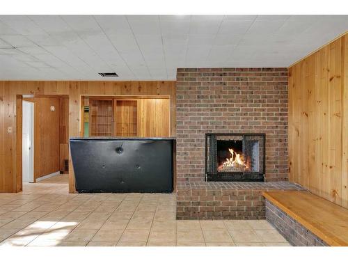 3903 Charleswood Drive Nw, Calgary, AB - Indoor Photo Showing Other Room With Fireplace