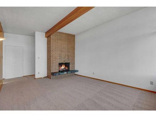 3903 Charleswood Drive Nw, Calgary, AB - Indoor With Fireplace