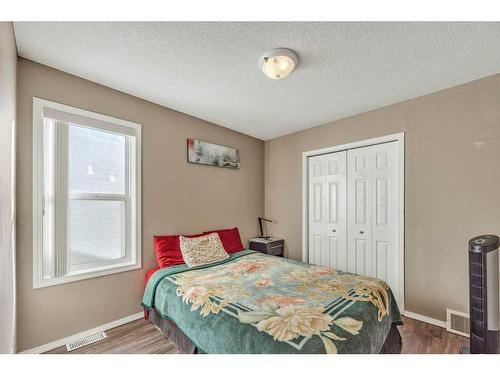 283 Coville Close Ne, Calgary, AB - Indoor Photo Showing Living Room With Fireplace