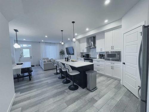 242 Chelsea Heath, Chestermere, AB - Indoor Photo Showing Kitchen With Upgraded Kitchen