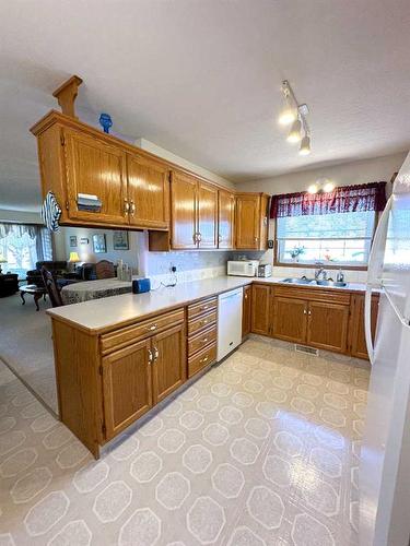 5601 Sunrise Crescent, Olds, AB - Indoor Photo Showing Kitchen With Double Sink