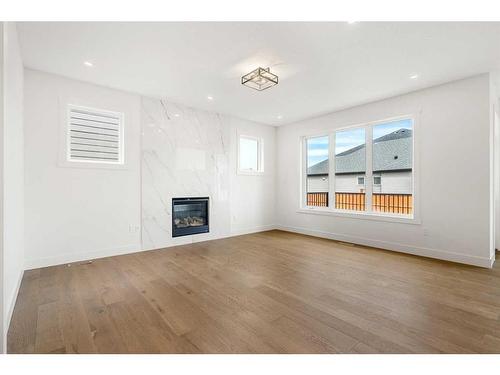 319 Legacy Mount Se, Calgary, AB - Indoor Photo Showing Living Room With Fireplace