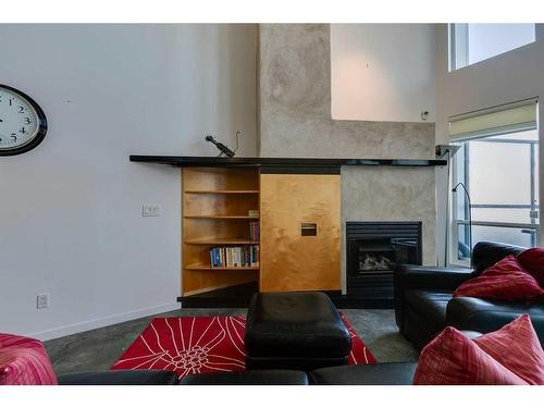 114-1800 26 Avenue Sw, Calgary, AB - Indoor Photo Showing Living Room With Fireplace