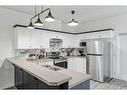 703-2001 Luxstone Boulevard Sw, Airdrie, AB  - Indoor Photo Showing Kitchen With Stainless Steel Kitchen With Double Sink 