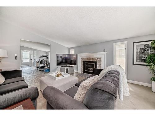 5519 Buckthorn Road Nw, Calgary, AB - Indoor Photo Showing Living Room With Fireplace