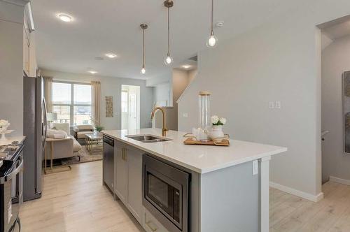 119 Legacy Passage Se, Calgary, AB - Indoor Photo Showing Kitchen With Double Sink With Upgraded Kitchen