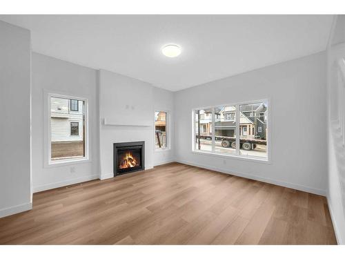 255 Baneberry Way, Airdrie, AB - Indoor Photo Showing Living Room With Fireplace