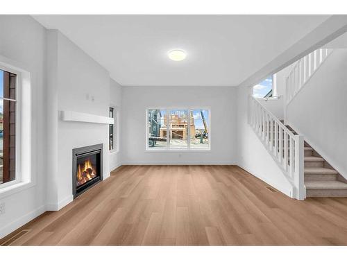 255 Baneberry Way, Airdrie, AB - Indoor Photo Showing Living Room With Fireplace