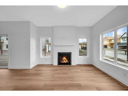 255 Baneberry Way, Airdrie, AB - Indoor Photo Showing Living Room With Fireplace