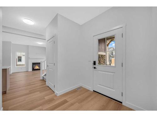 255 Baneberry Way, Airdrie, AB - Indoor Photo Showing Other Room With Fireplace