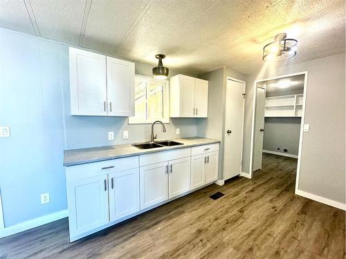 1921 21 Street, Nanton, AB - Indoor Photo Showing Kitchen With Double Sink