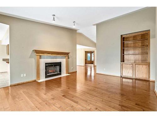 125 Shawnee Place Sw, Calgary, AB - Indoor Photo Showing Living Room With Fireplace