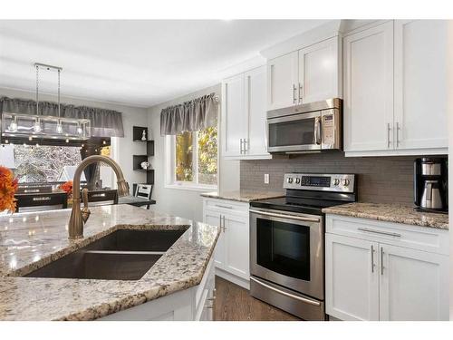 36 Tuscany Hills Close Nw, Calgary, AB - Indoor Photo Showing Kitchen With Double Sink With Upgraded Kitchen