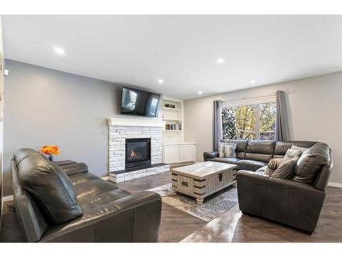 36 Tuscany Hills Close Nw, Calgary, AB - Indoor Photo Showing Living Room With Fireplace