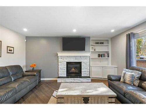 36 Tuscany Hills Close Nw, Calgary, AB - Indoor Photo Showing Living Room With Fireplace