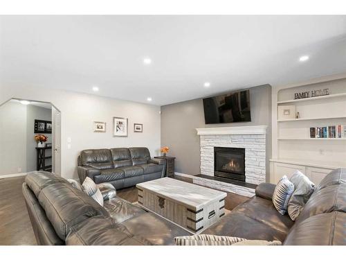 36 Tuscany Hills Close Nw, Calgary, AB - Indoor Photo Showing Living Room With Fireplace