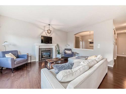 97 Everhollow Rise Sw, Calgary, AB - Indoor Photo Showing Living Room With Fireplace