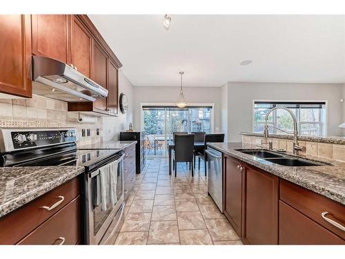 97 Everhollow Rise Sw, Calgary, AB - Indoor Photo Showing Kitchen With Double Sink