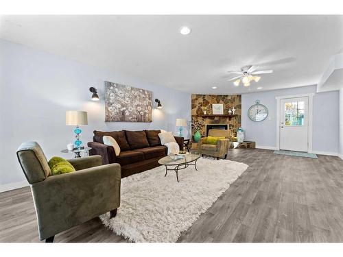 3108 39 Street Se, Calgary, AB - Indoor Photo Showing Living Room With Fireplace