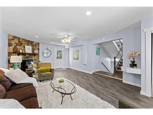 3108 39 Street Se, Calgary, AB - Indoor Photo Showing Living Room With Fireplace