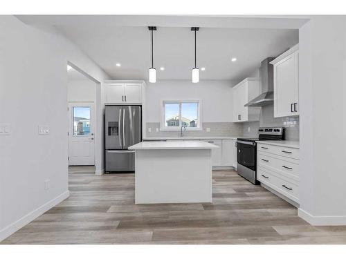 834 Bayview Terrace Sw, Airdrie, AB - Indoor Photo Showing Kitchen With Stainless Steel Kitchen With Upgraded Kitchen