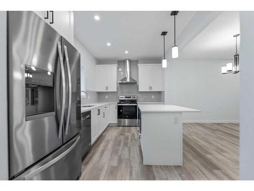 834 Bayview Terrace Sw, Airdrie, AB - Indoor Photo Showing Kitchen With Stainless Steel Kitchen With Upgraded Kitchen