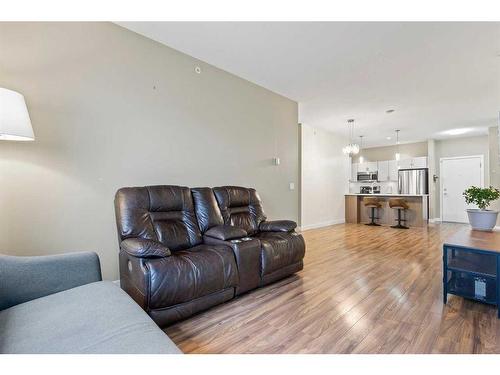 401-10 Auburn Bay Link Se, Calgary, AB - Indoor Photo Showing Living Room