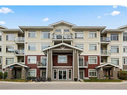 401-10 Auburn Bay Link Se, Calgary, AB - Outdoor With Balcony With Facade