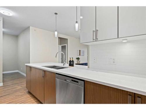 401-10 Auburn Bay Link Se, Calgary, AB - Indoor Photo Showing Kitchen With Double Sink With Upgraded Kitchen