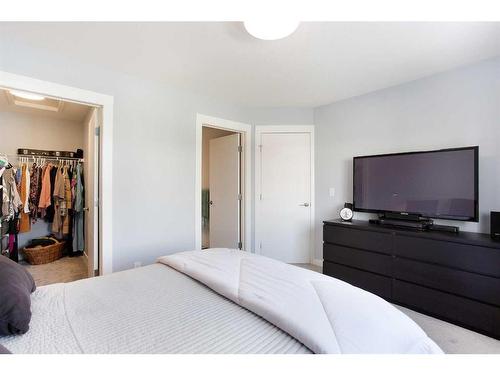 106-800 Yankee Valley Boulevard Se, Airdrie, AB - Indoor Photo Showing Bedroom