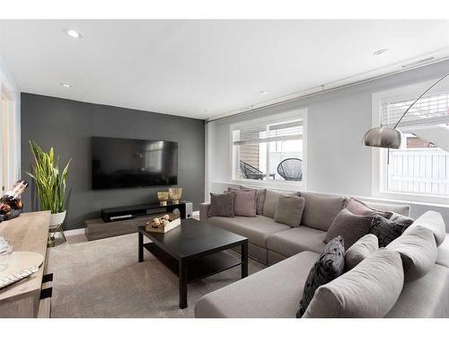 106-800 Yankee Valley Boulevard Se, Airdrie, AB - Indoor Photo Showing Living Room