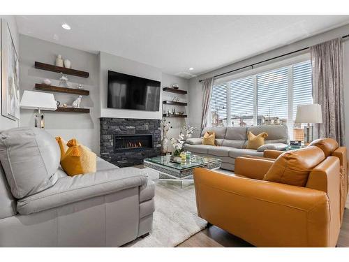 56 Legacy Bay Se, Calgary, AB - Indoor Photo Showing Living Room With Fireplace