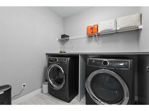 56 Legacy Bay Se, Calgary, AB - Indoor Photo Showing Laundry Room