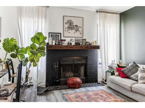 395 Millrise Drive Sw, Calgary, AB - Indoor Photo Showing Living Room With Fireplace