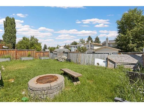 395 Millrise Drive Sw, Calgary, AB - Outdoor With Backyard