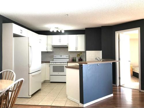 2318-60 Panatella Street Nw, Calgary, AB - Indoor Photo Showing Kitchen